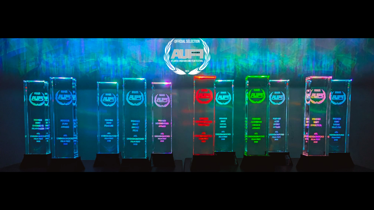 Neon awards trophies from the Atlanta Underground Film Festival 2023, with various categories and colorful lighting.