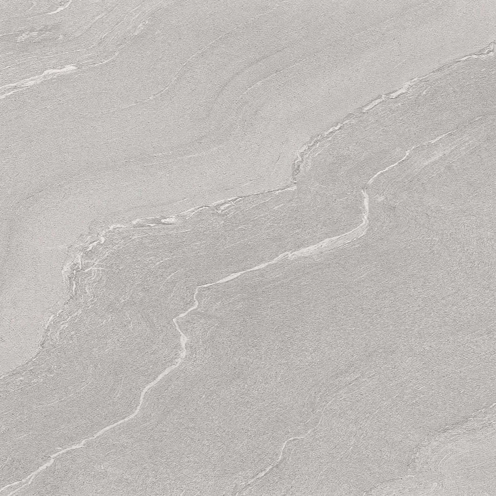 Close-up view of a light gray stone or tile surface with natural-looking veins and textures.