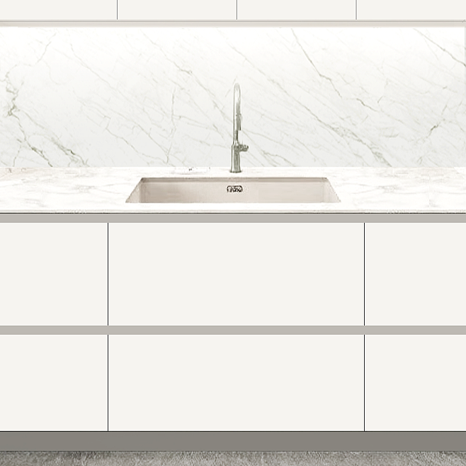 Kitchen countertop with a white marble pattern, a single undermount sink, and a modern faucet.