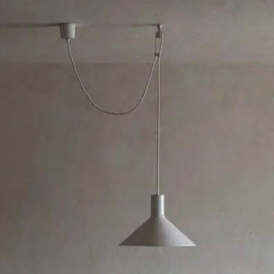 A white pendant light hanging from a white ceiling, with a cord and chain connected to the ceiling