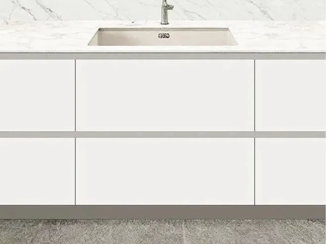 Kitchen cabinet with a sink and a marble countertop.