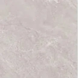 Close-up of a light gray, slightly textured surface, possibly concrete or stone.