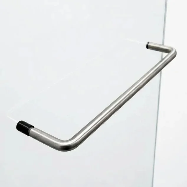 A metal handrail attached to a white wall.