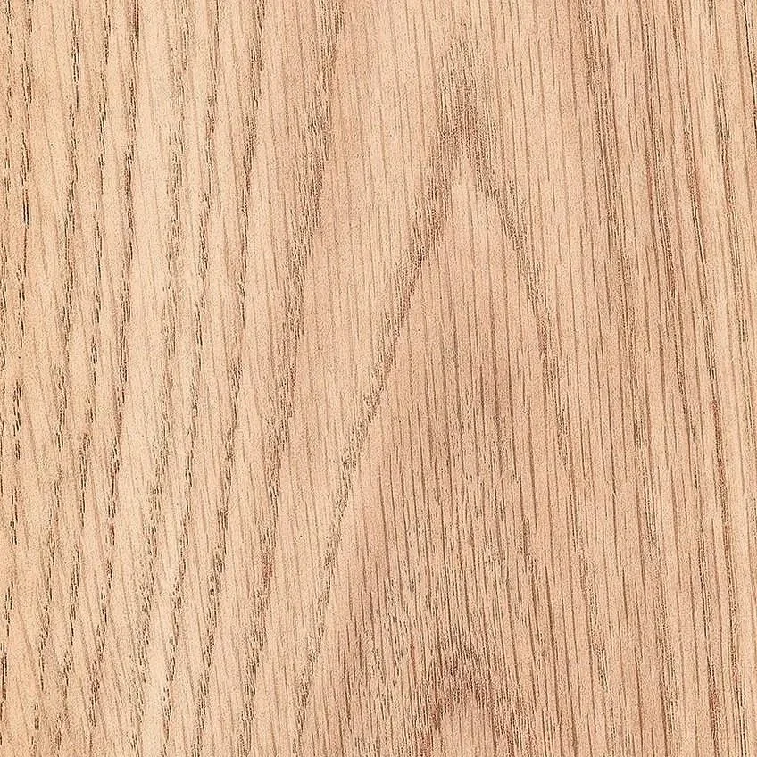Close-up of a light-colored wooden surface with visible grain patterns.