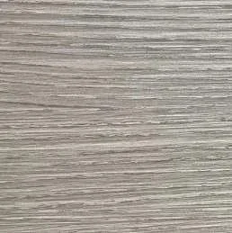 Close-up of a textured, light-colored wooden surface.