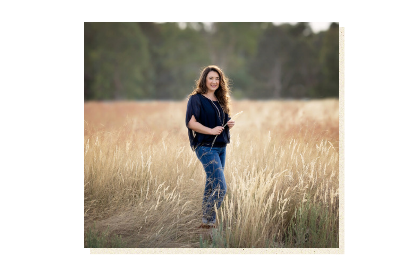 Kylie Mansfield, historical fiction author, standing in a golden field
