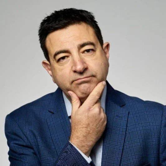 "Domenic Saporito, Founder and CEO of Nano Tech Systems, smiling in professional business attire."