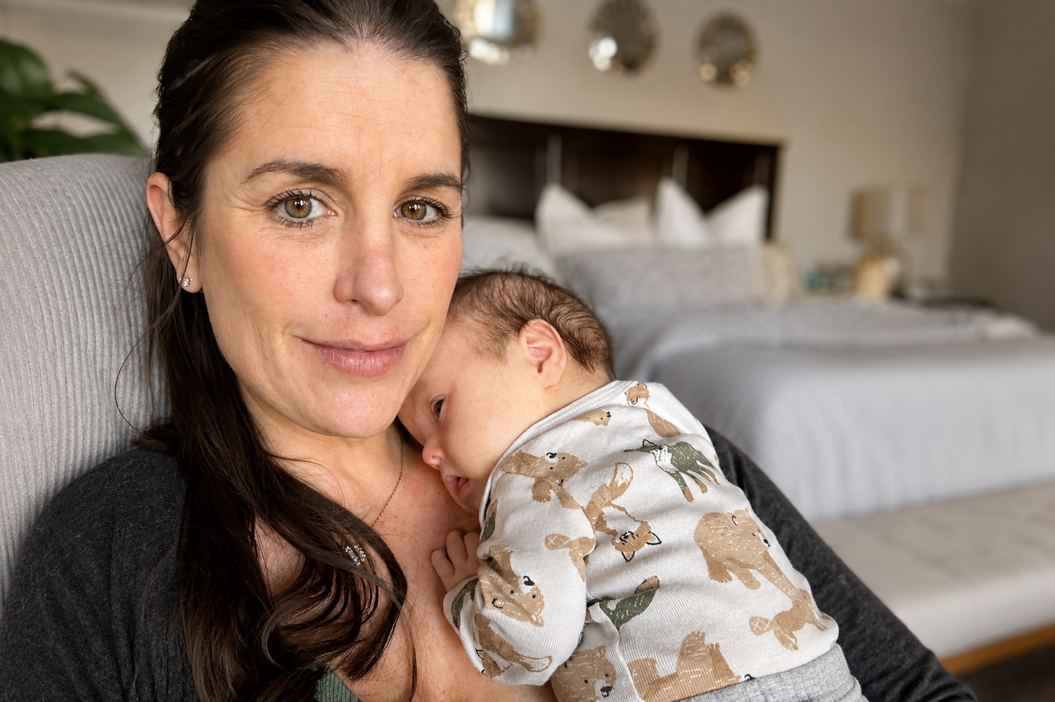 New mother holding son with Down Syndrome after he came home from the hospital.