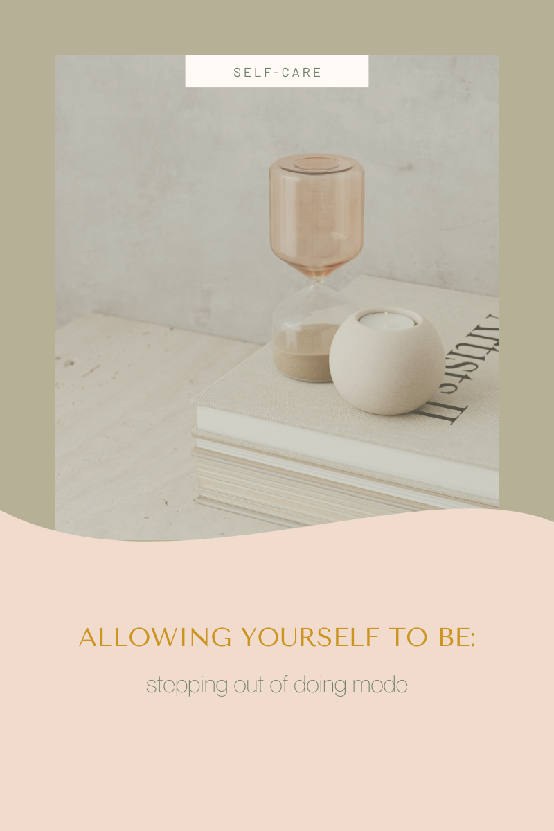 Minimalist Still Life with Beige Hourglass and a Candle on Books