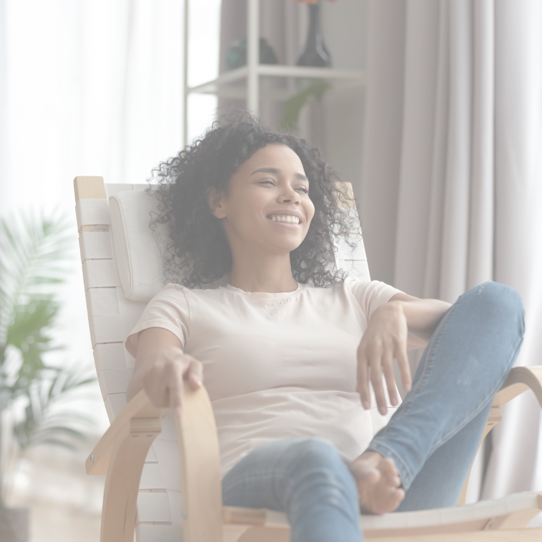 Smiling woman relaxing in a chair