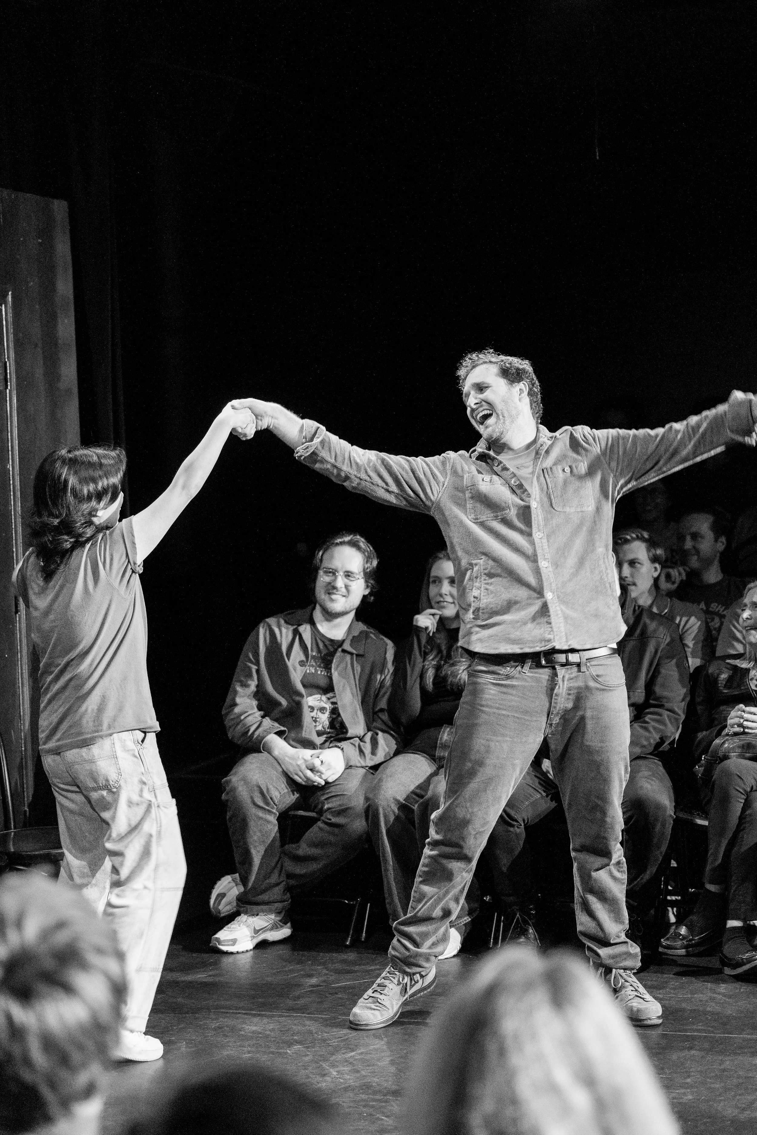 Patrick McDonald and Alex Song-Xia performing a live improv comedy set on stage at The Upright Citizens Brigade in Hollywood, captured by a local comedy photographer.