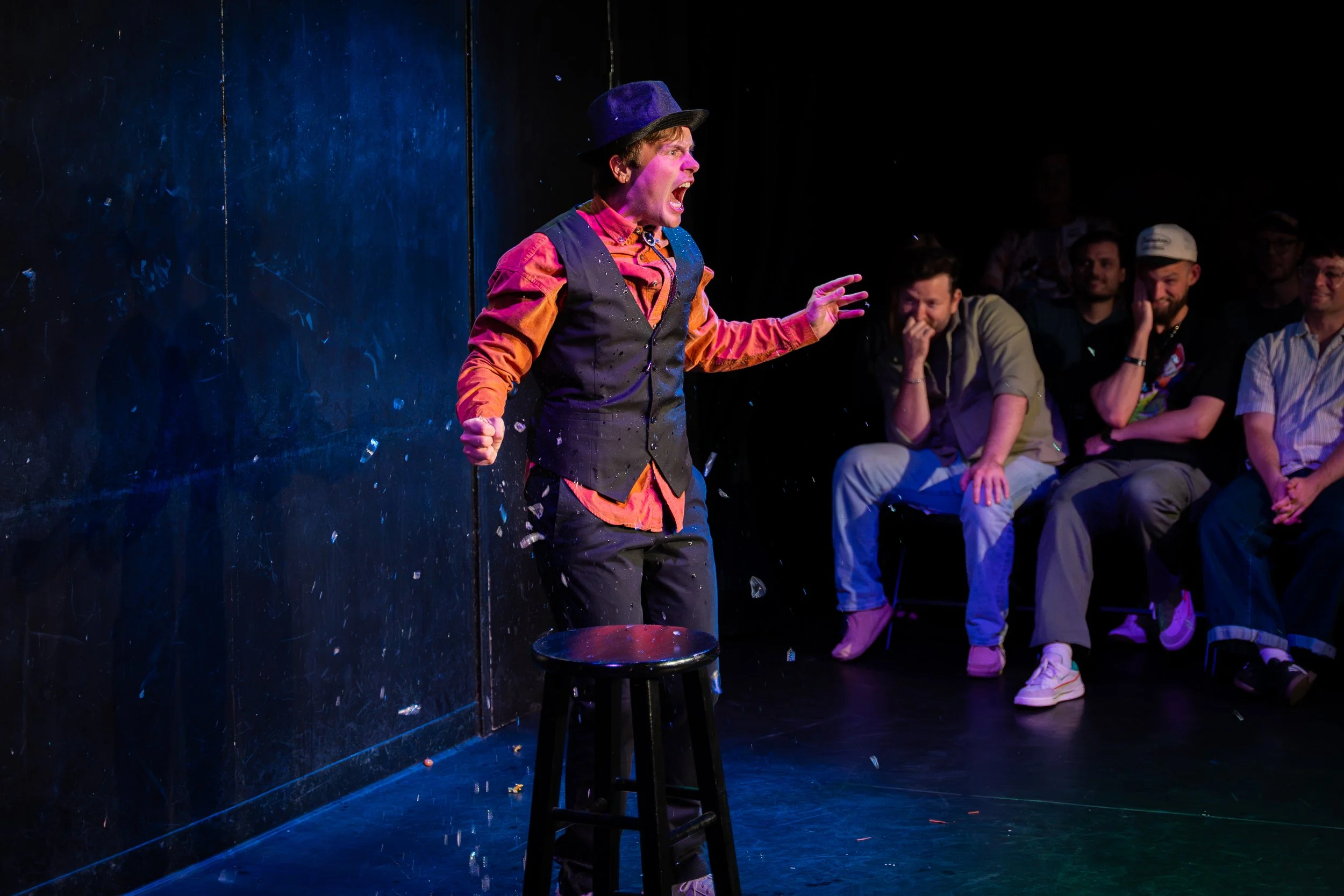 Chaz May performing a live sketch comedy set on stage at The Upright Citizens Brigade in Hollywood, captured by a local comedy photographer.