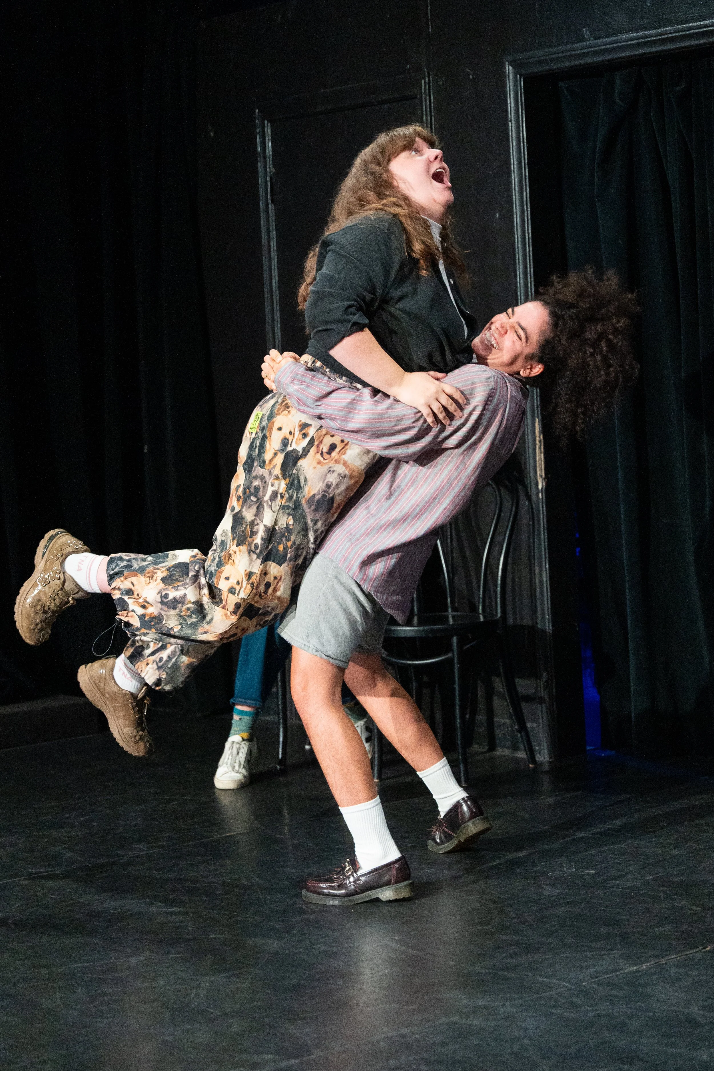 Kimia Behpoornia lifting Jordan Myrick during ASSSSCAT, a live improv comedy show at The Upright Citizens Brigade in Hollywood, captured by a local comedy photographer.
