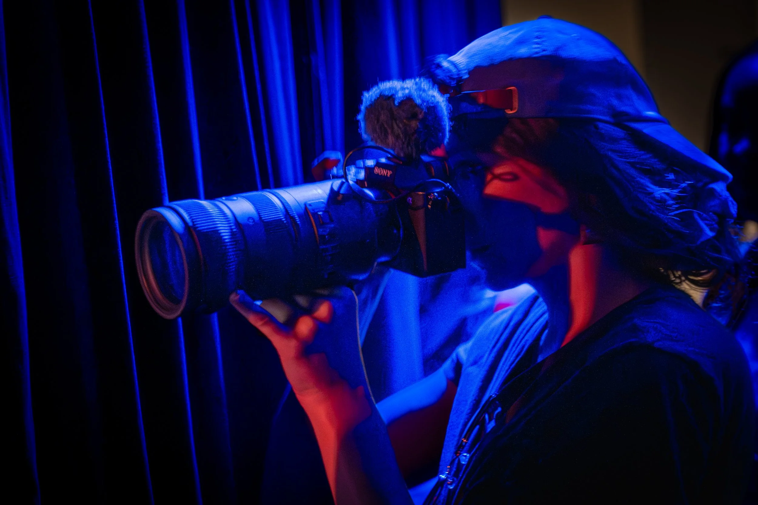 Jill Petracek taking photos at a live improv comedy set on stage at The Upright Citizens Brigade in Hollywood, captured by a local comedy photographer.