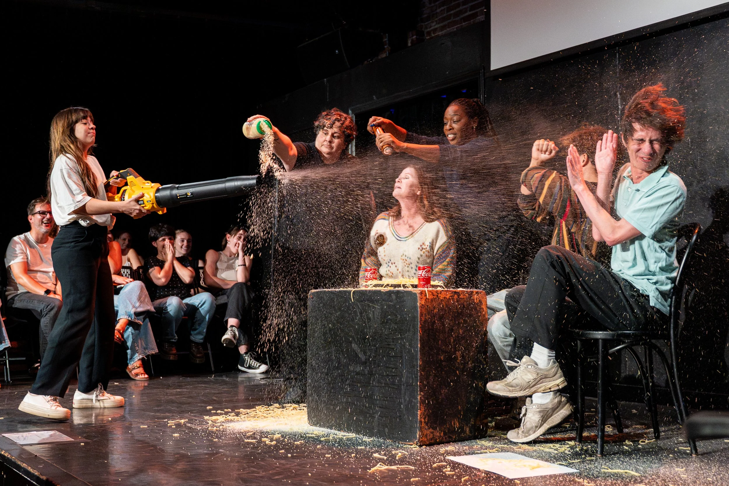 Ruha  Taslimi and several other performers performing a live sketch comedy set on stage at The Upright Citizens Brigade in Hollywood, captured by a local comedy photographer.