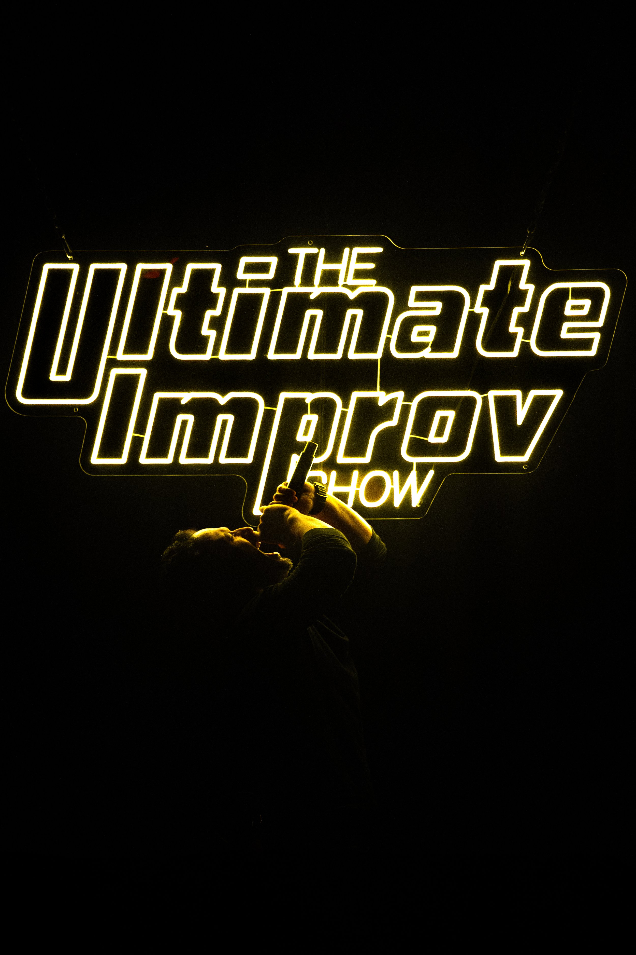 Dan Black performing a live sketch comedy set on stage at The Upright Citizens Brigade in Hollywood, captured by a local comedy photographer.
