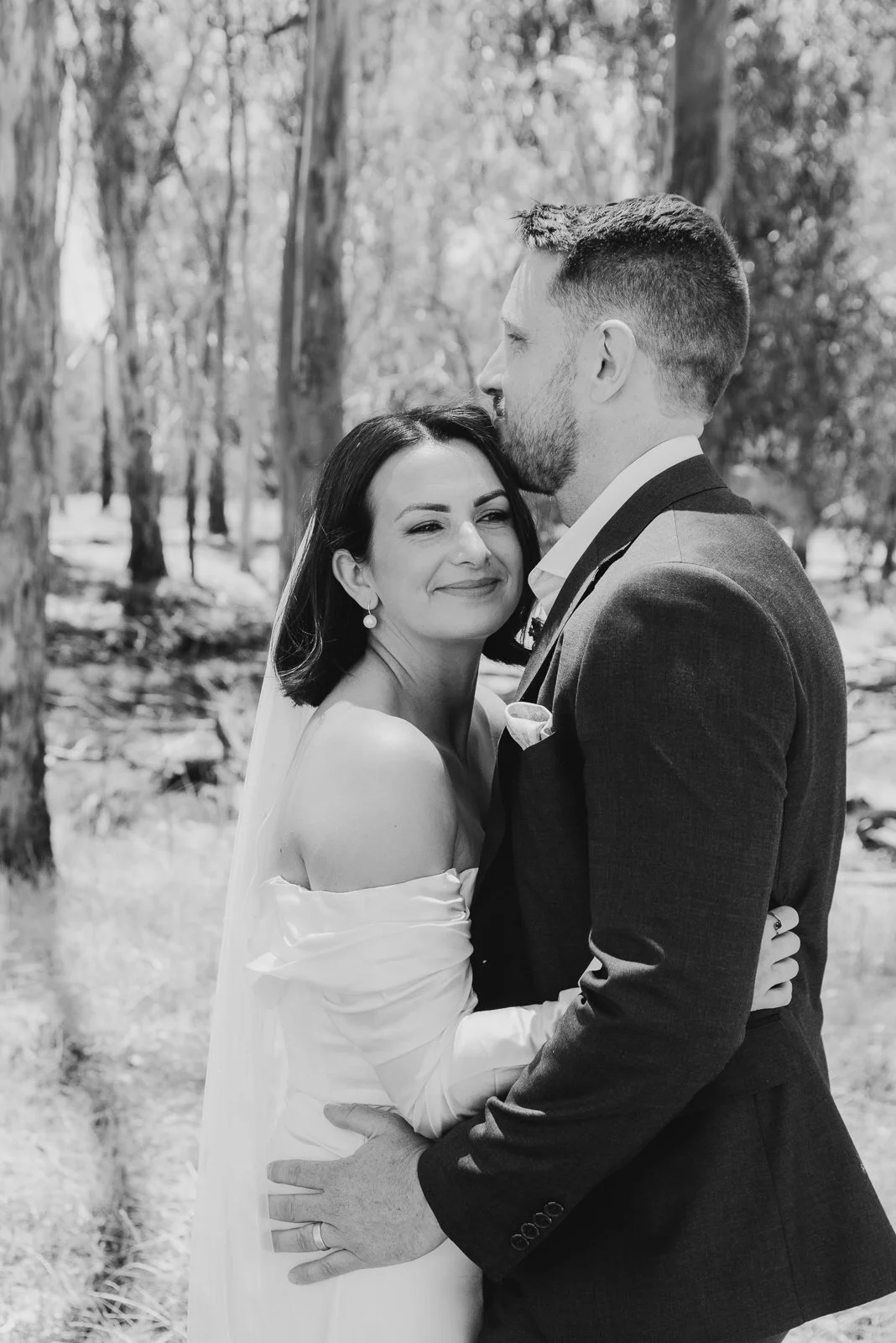 Relaxed wedding portrait down by the river at St Leonards Vineyard