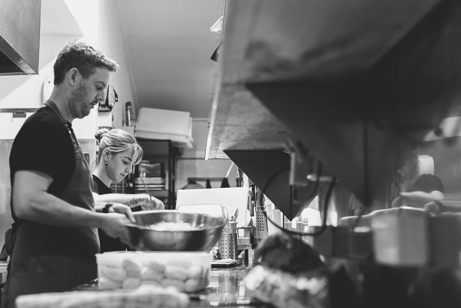 Kitchen team preparing food behind the scenes at Grace Bar + Eatery in Rutherglen.