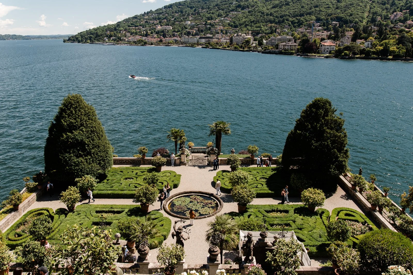 Formal Italian garden with manicured hedges overlooking Lake Maggiore photographed as destination landscape photography.