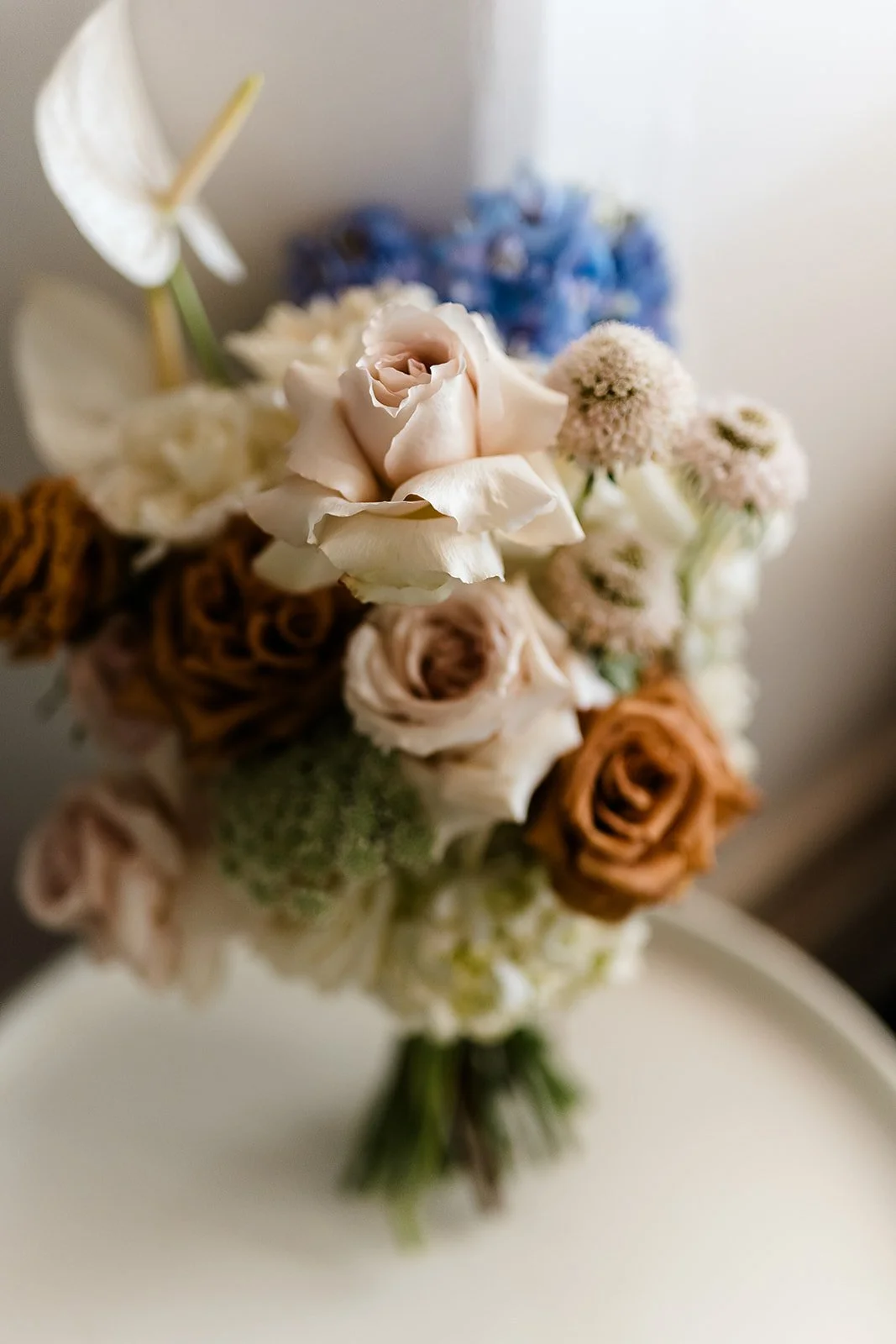 wedding bouquet sits on a chair waiting for the bride to pick it up