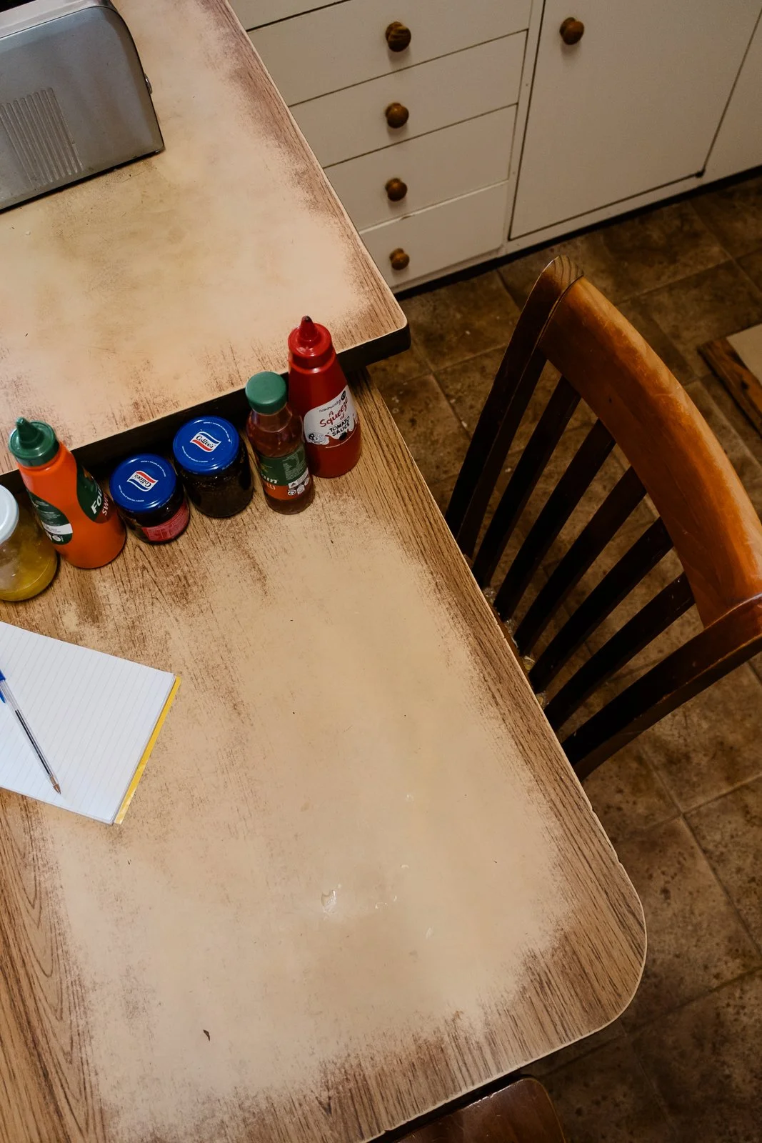 Worn Laminex kitchen table in the family home