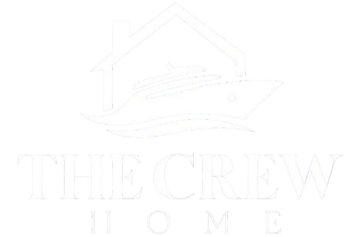 Logo with a house outline and a yacht inside, with the text 'The Crew Home' beneath.