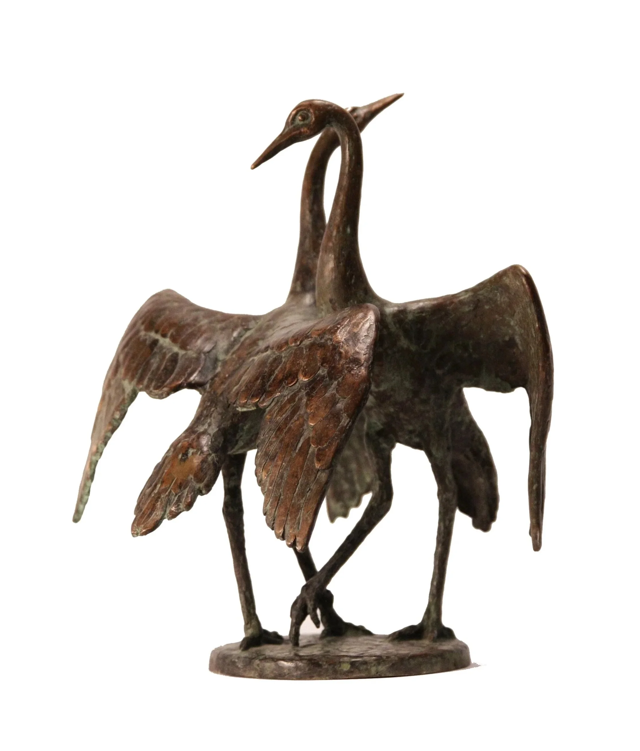 Bronze sculpture of a bird with long neck and beak, standing on a oval base.
