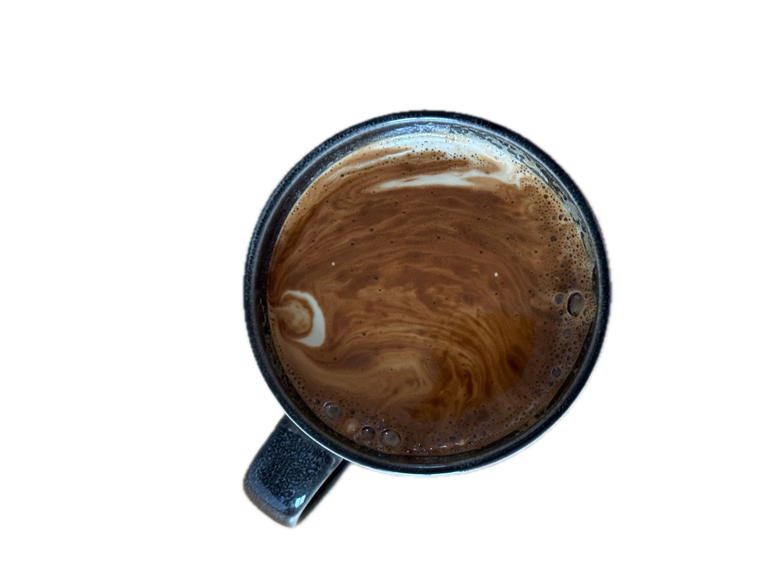 A close-up view of a coffee mug filled with a foamy, swirled coffee drink against a black background.