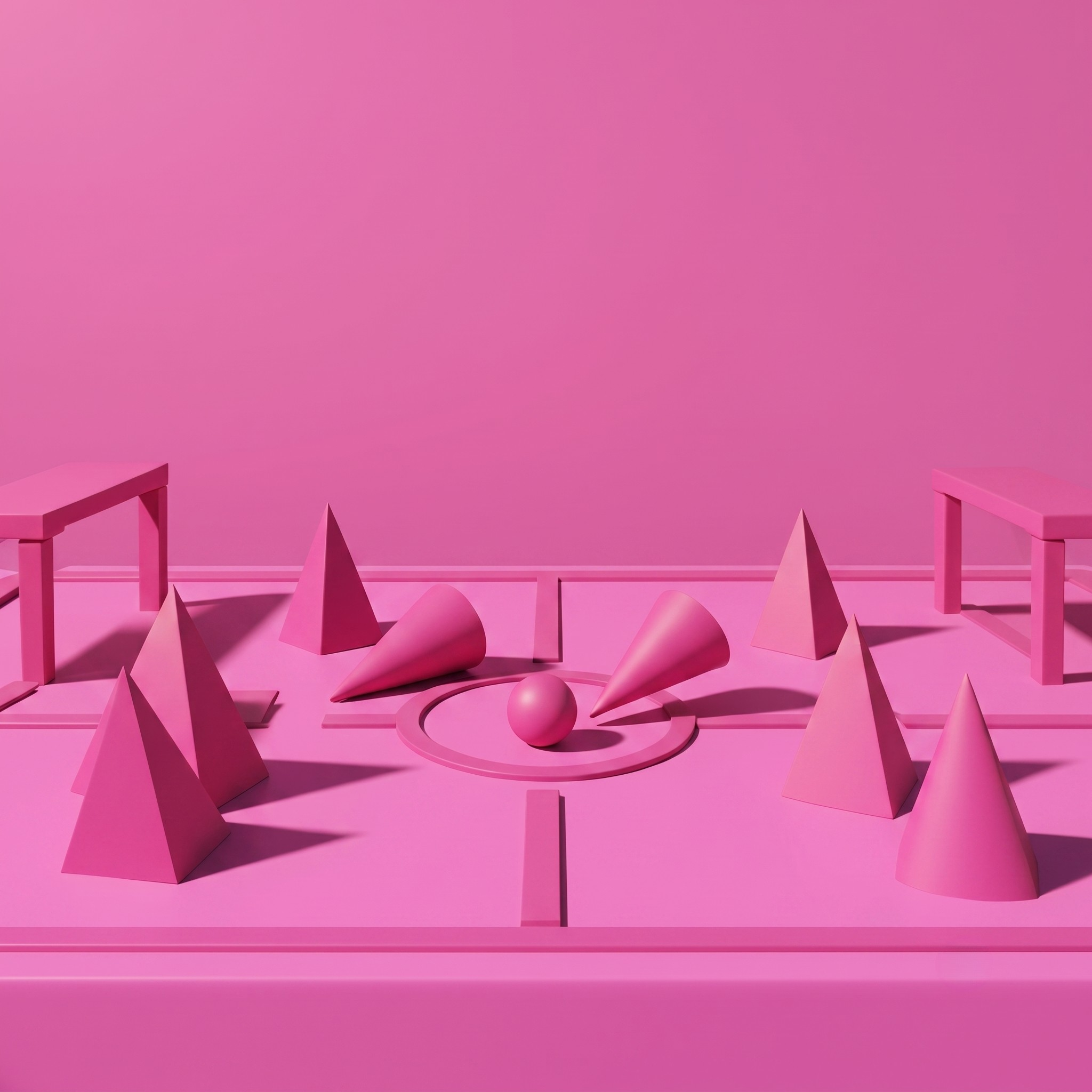 Pink room with pink geometric wooden blocks symbolising a football match, all against a pink background.