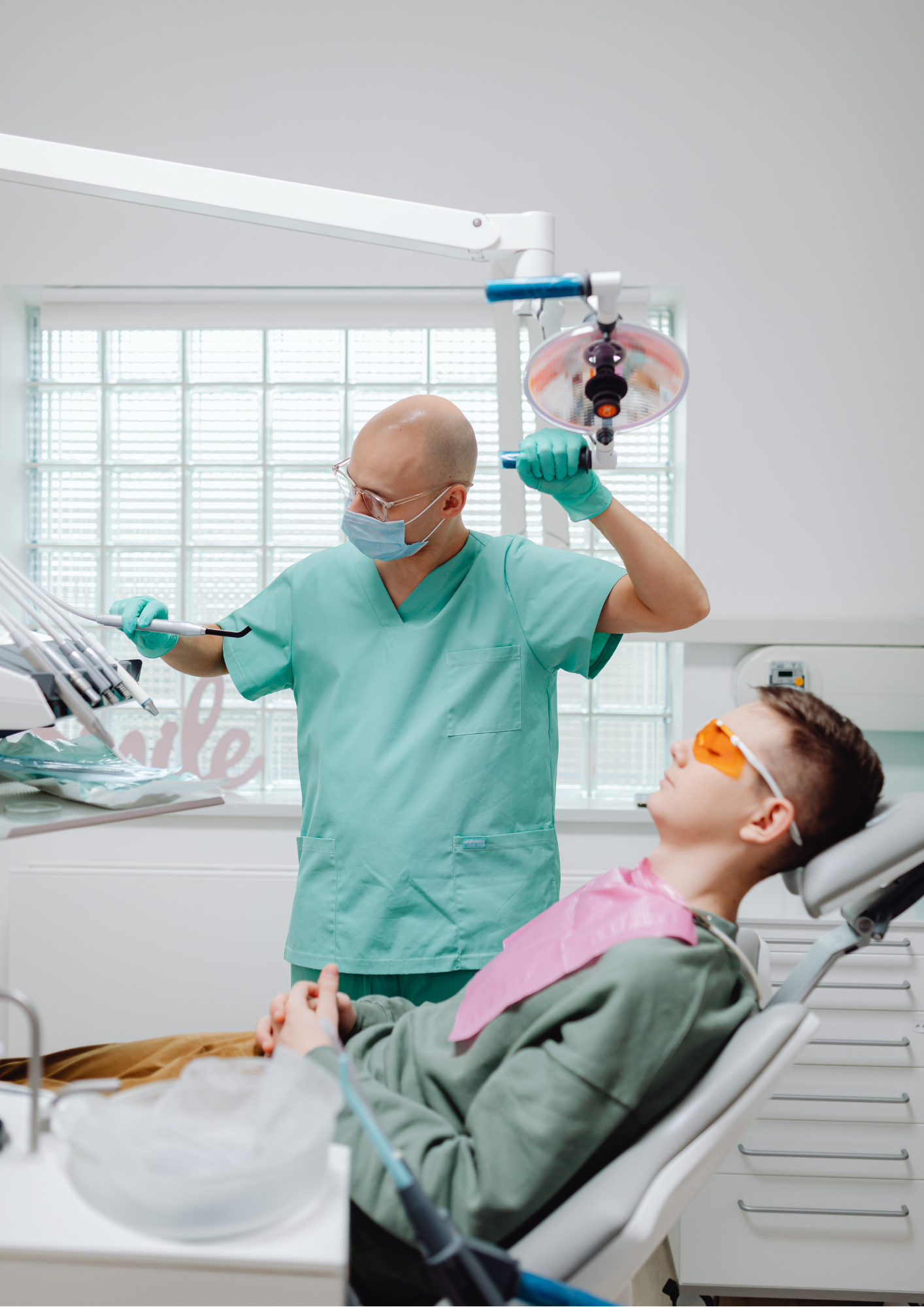 dentist with patient in chair