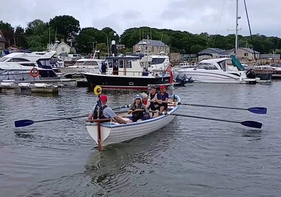 River Teign Longboat 'Maggie May' newly launched after a refit.