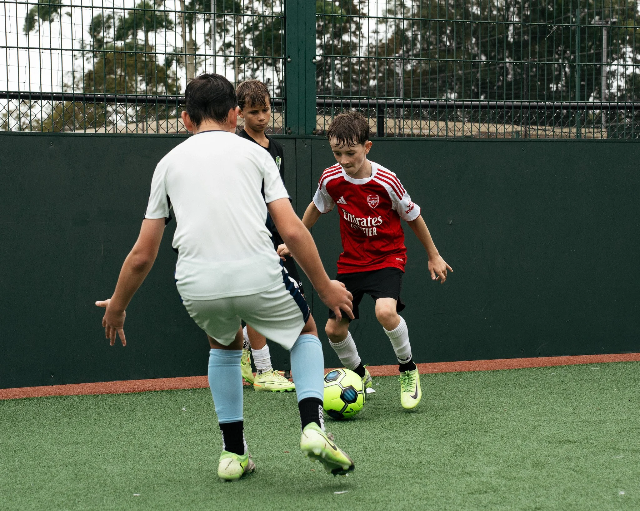 Young players working on close control and 1v1 skills during a KB Football Academy training session.