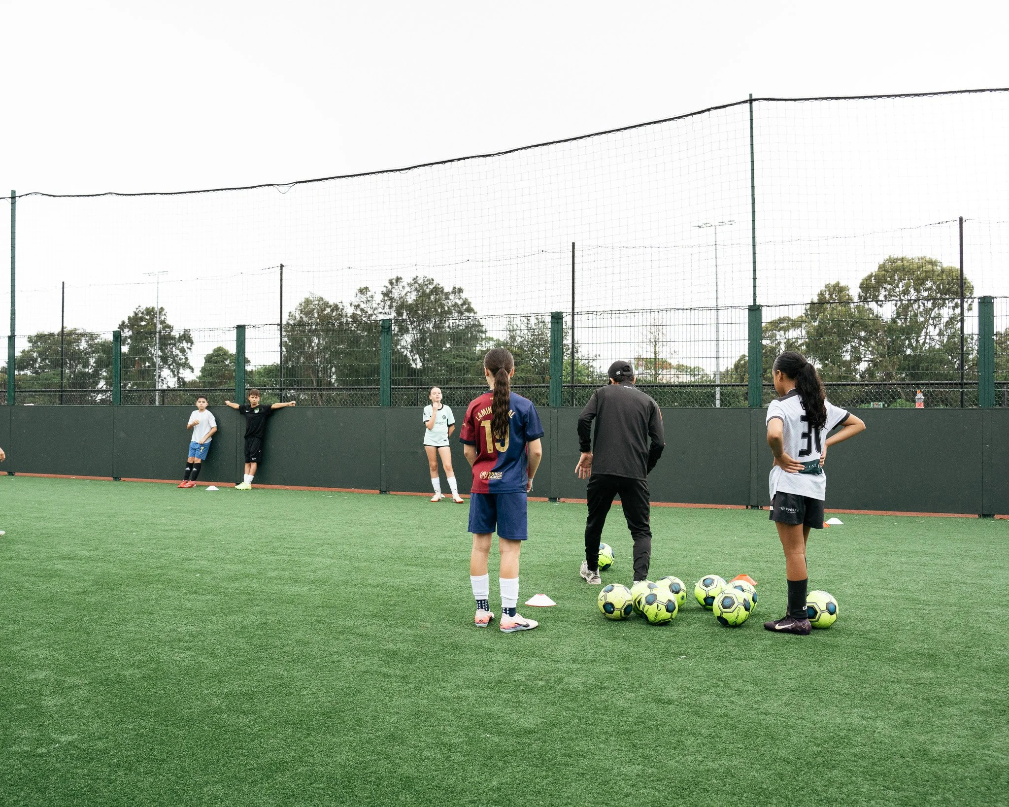 Young players taking part in a small-group football training session at KB Football Academy in Caringbah.