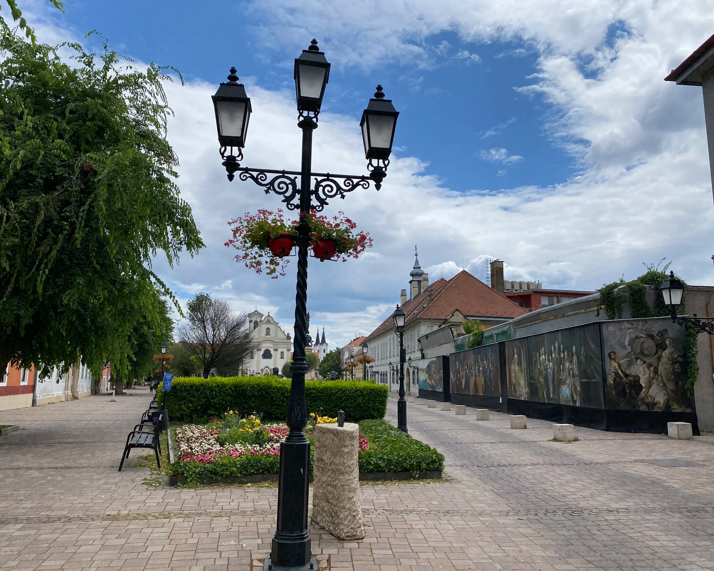 Vác Main Square with lamp post and flowers in Hungary