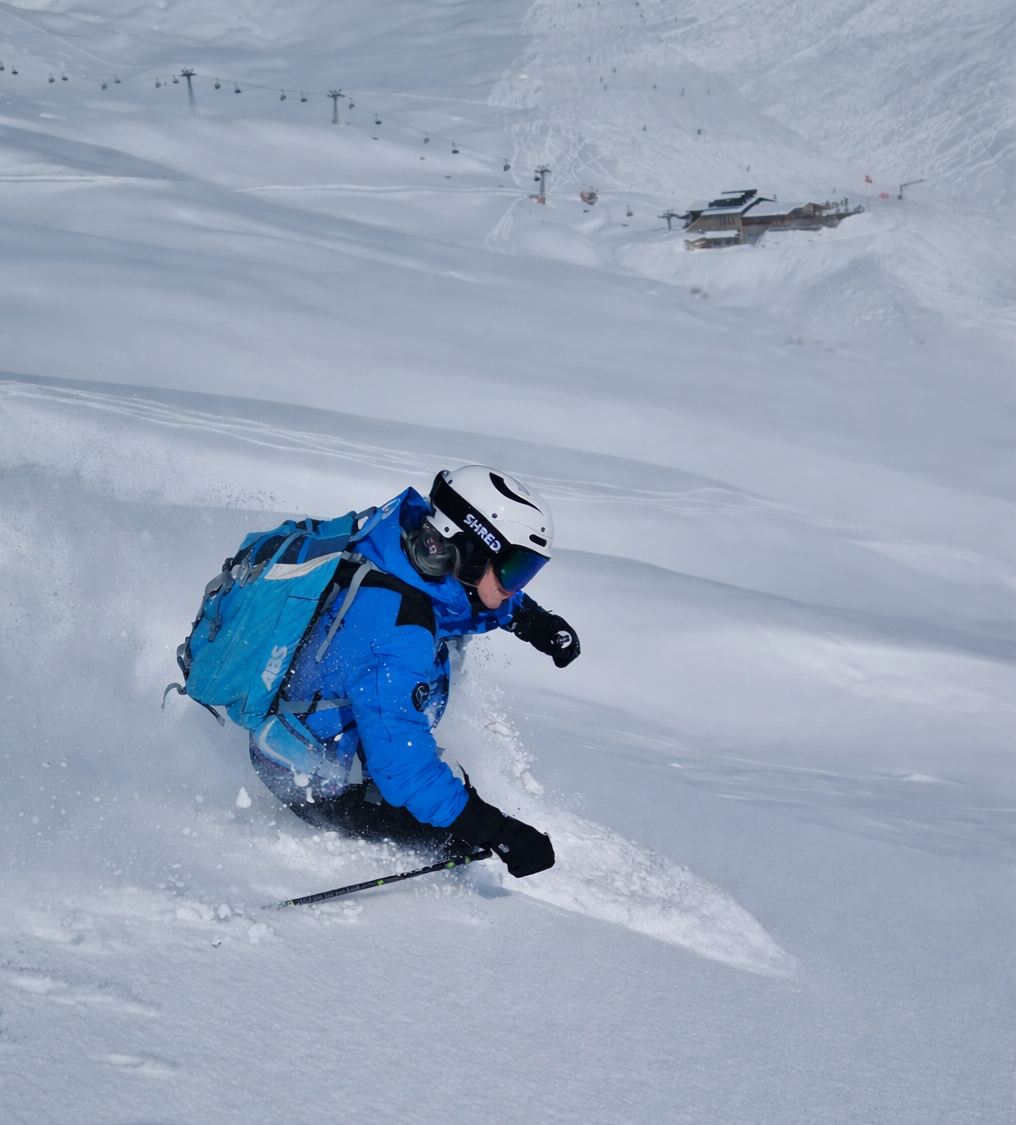 Powder skiing with lift in the background in St. Moritz, Switzerland