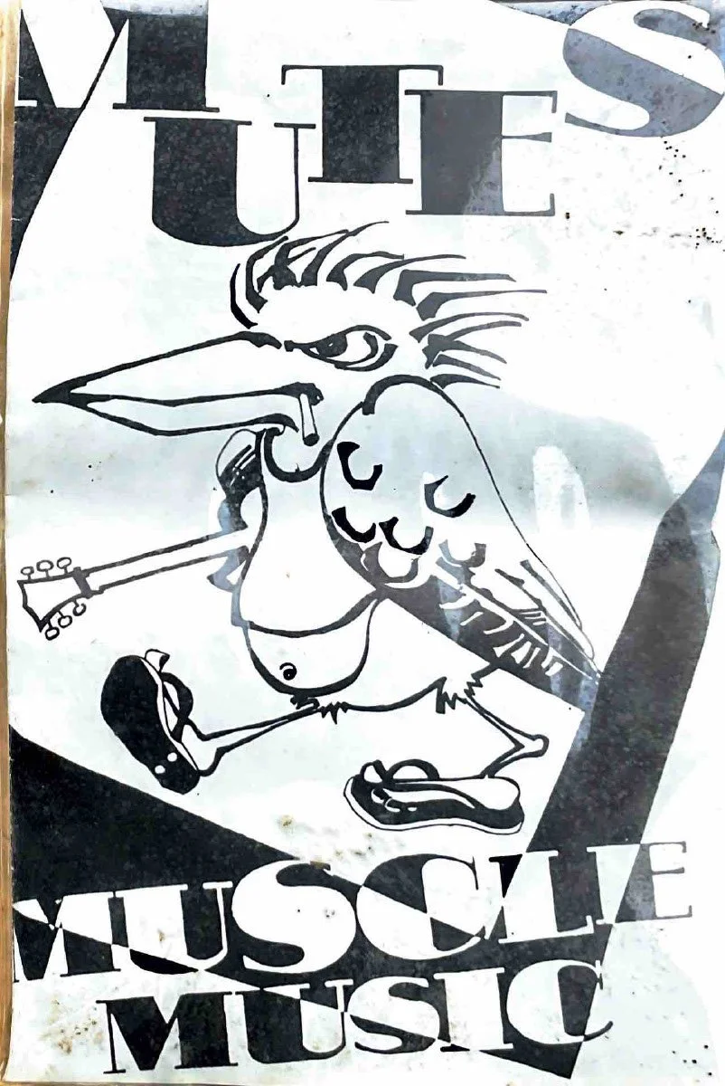 A black and white drawing of a cartoon chicken playing guitar, with the words 'MUSCLE MUSIC' at the bottom and part of the text 'MILES' at the top.