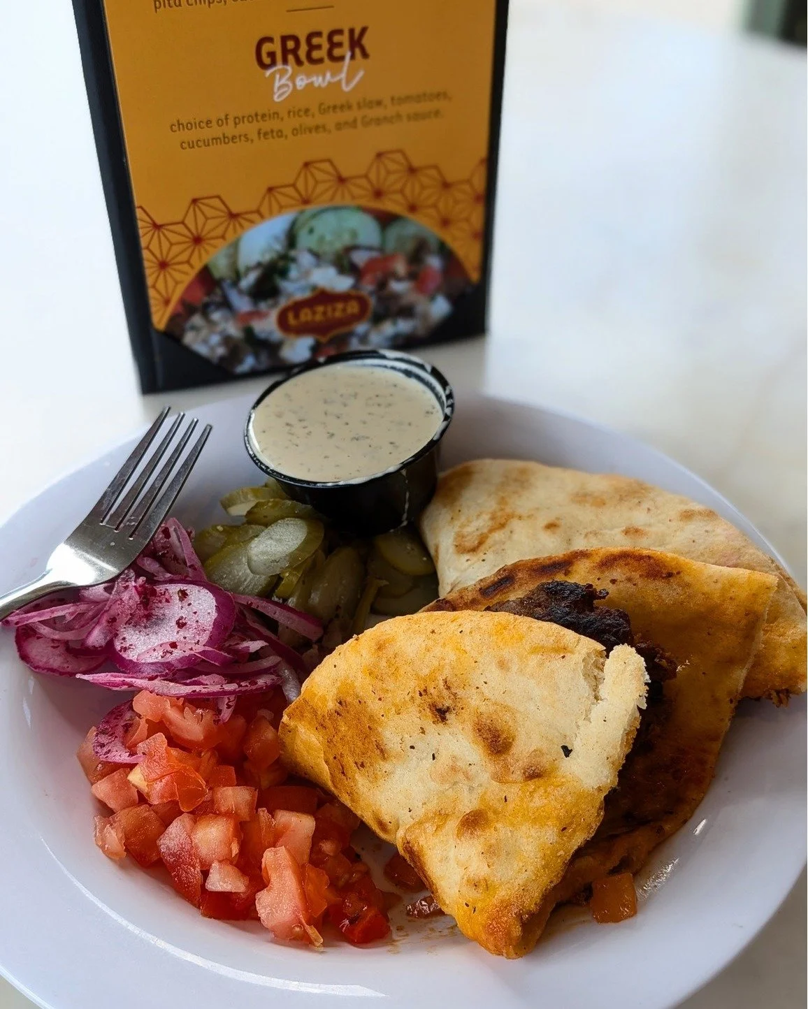 Street food, but make it Mediterranean -- the Arayes hits the spot! Delicious beef blend seasoned and stuffed in a pita, grilled and folded, and served with hummus, tomatoes, pickles, red onion, and our fresh herb tahini. 

Order yours today: lazizag