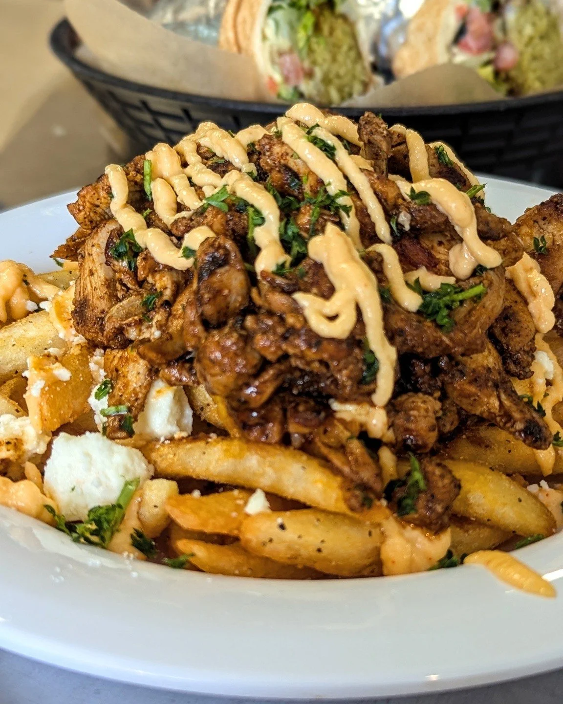 Just a reminder that Feta Fries loaded with our delicious chicken shawarma are a thing you should eat this week. 

Order: lazizagrill.com

#delicious #food #fetafries #eatlocal