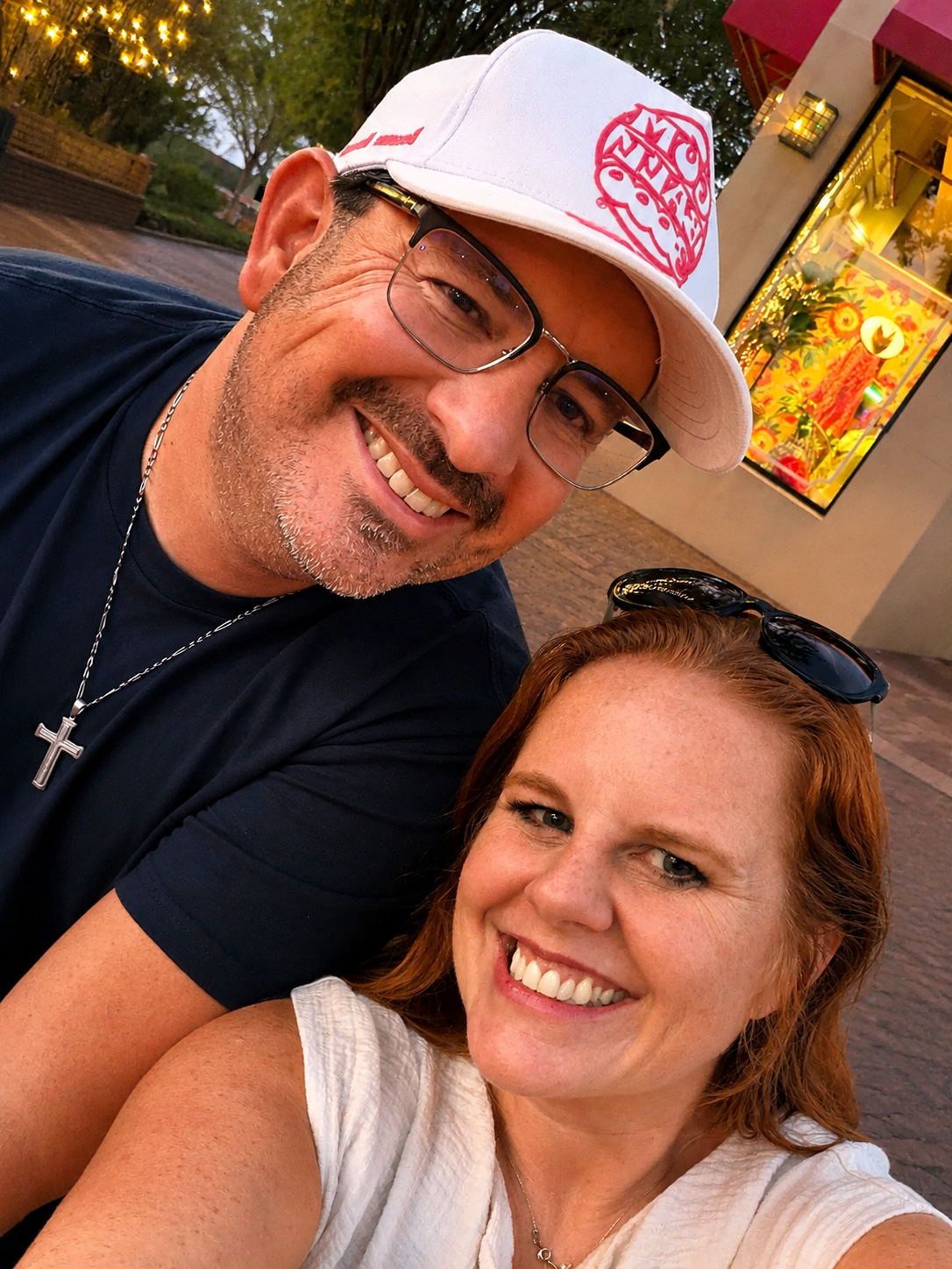 River branch founders, Mike and DeShawna, smiling together during an evening in Amelia Island, on the gumball 3000 grid.  They are reflecting the connection, travel, and outdoor adventure experiences that inspire their elopment photography company.