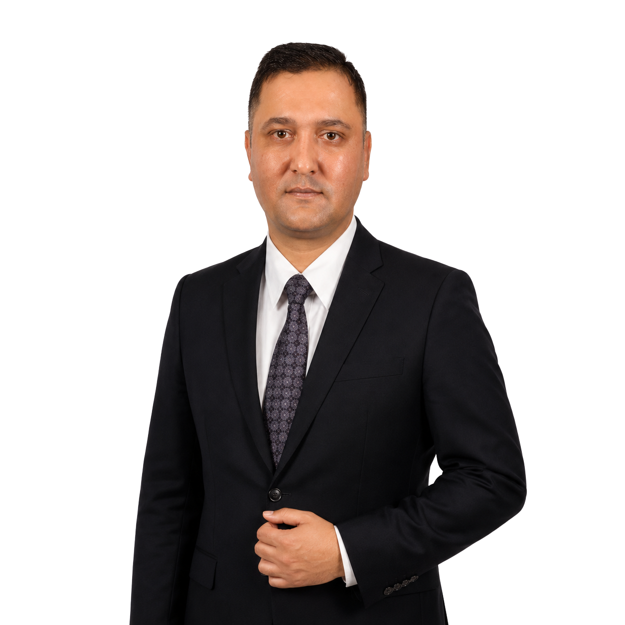 A man wearing a black suit, white shirt, and patterned tie posing for a professional portrait.