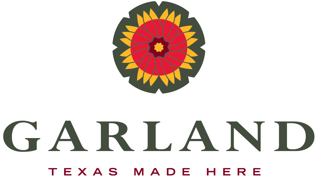 Logo with a circular floral design featuring red, yellow, and dark green colors, with the word "GARLAND" in large green letters below, and the phrase "TEXAS MADE HERE" in smaller red letters underneath.
