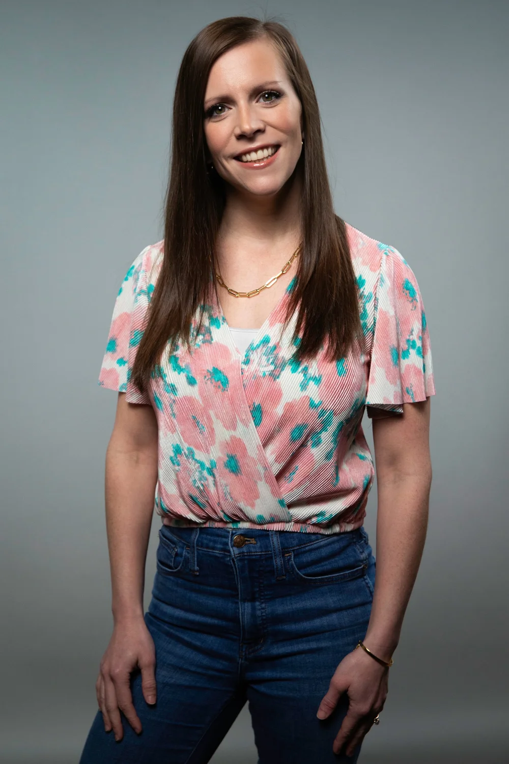Maggie Stenson, MCN, RD, LD, CEDS‑C, smiling in a pastel patterned top
