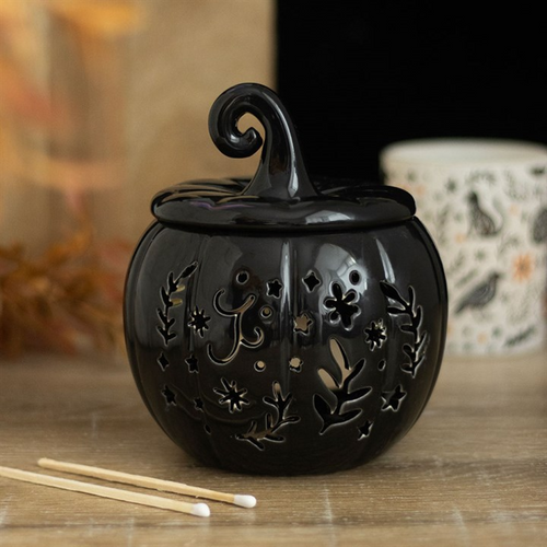 Black pumpkin oil burner with autumn-inspired design