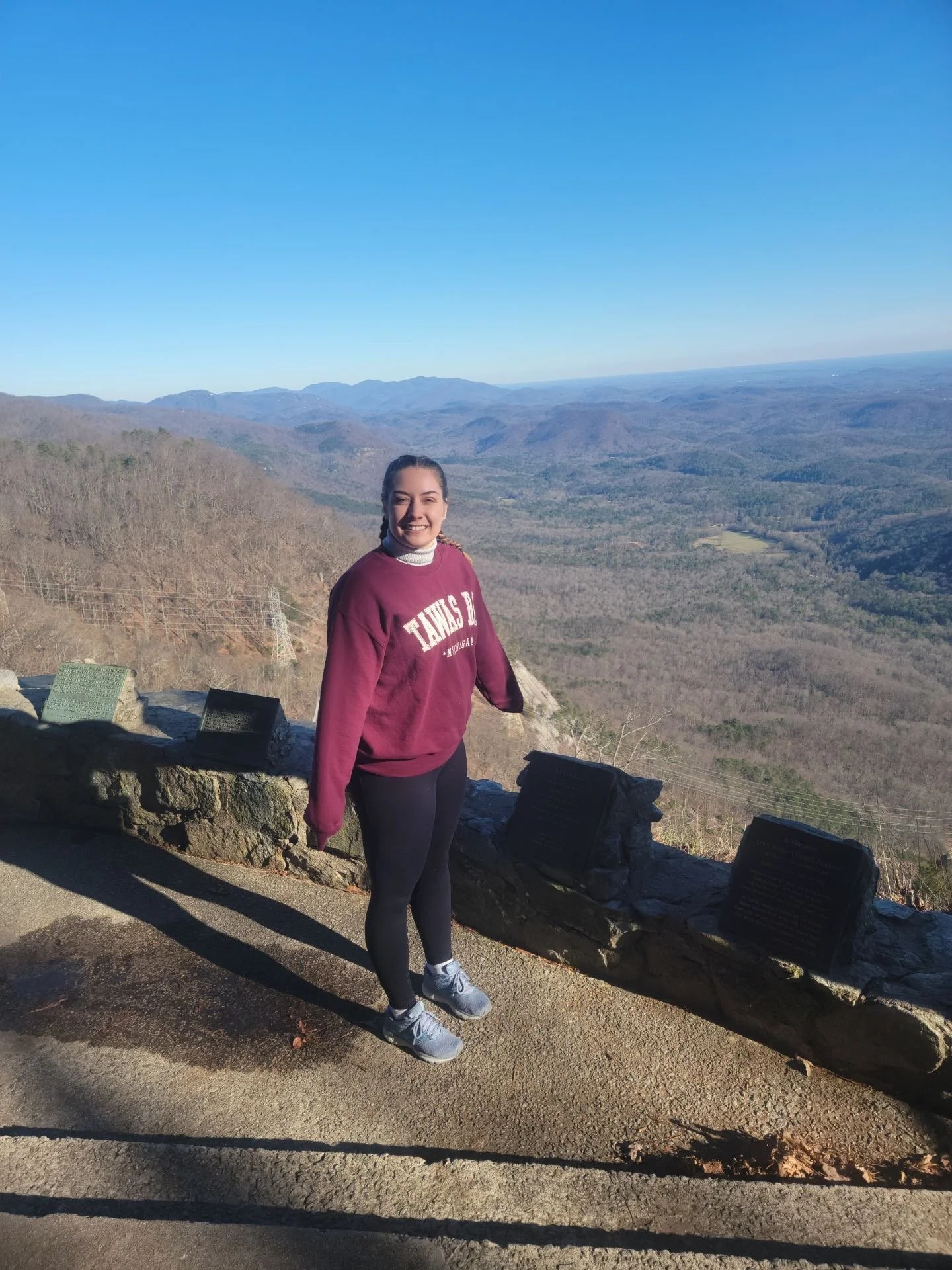 Joanna Jackson hiking outdoors, reflecting her appreciation for nature, growth, and wellness