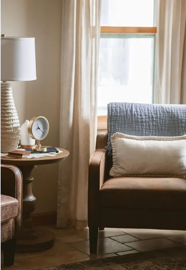 Warm, home-like therapy office corner at The Haven with soft lighting and comfortable seating