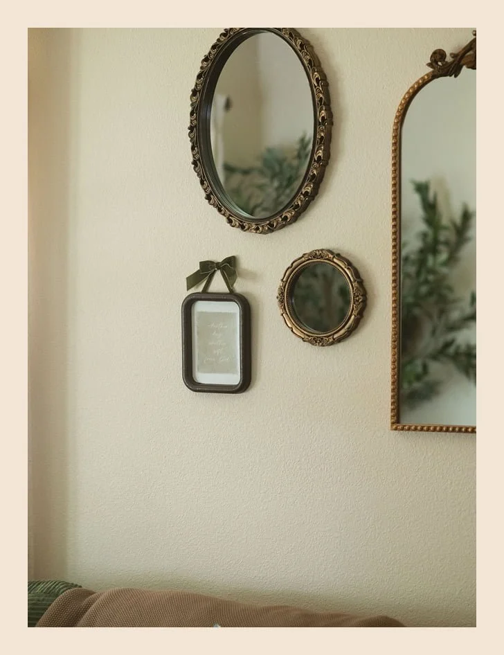 Vintage mirror gallery wall with a framed quote in a therapy office at The Haven