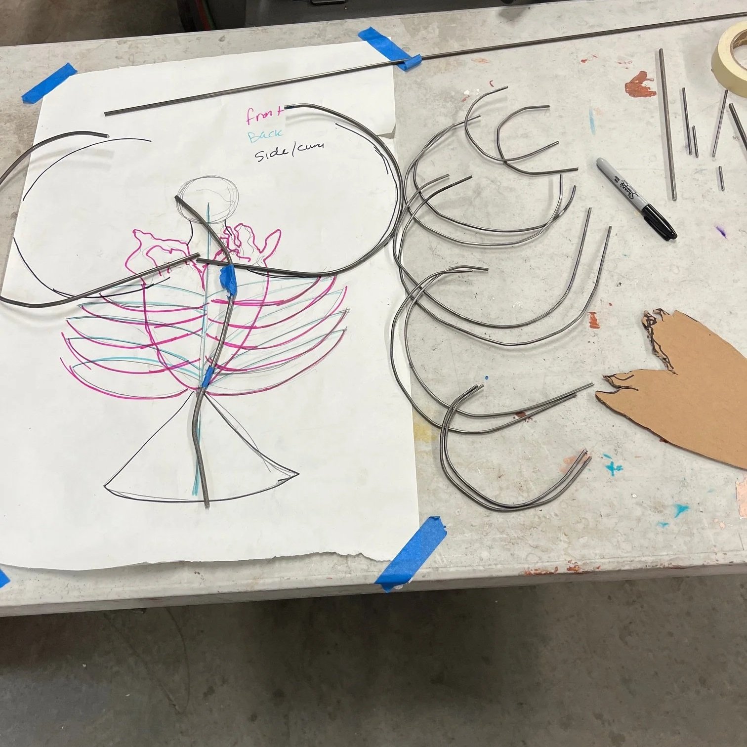Creating the armature: a scaled diagram was made, and steel rods were bent and cut to size. 
