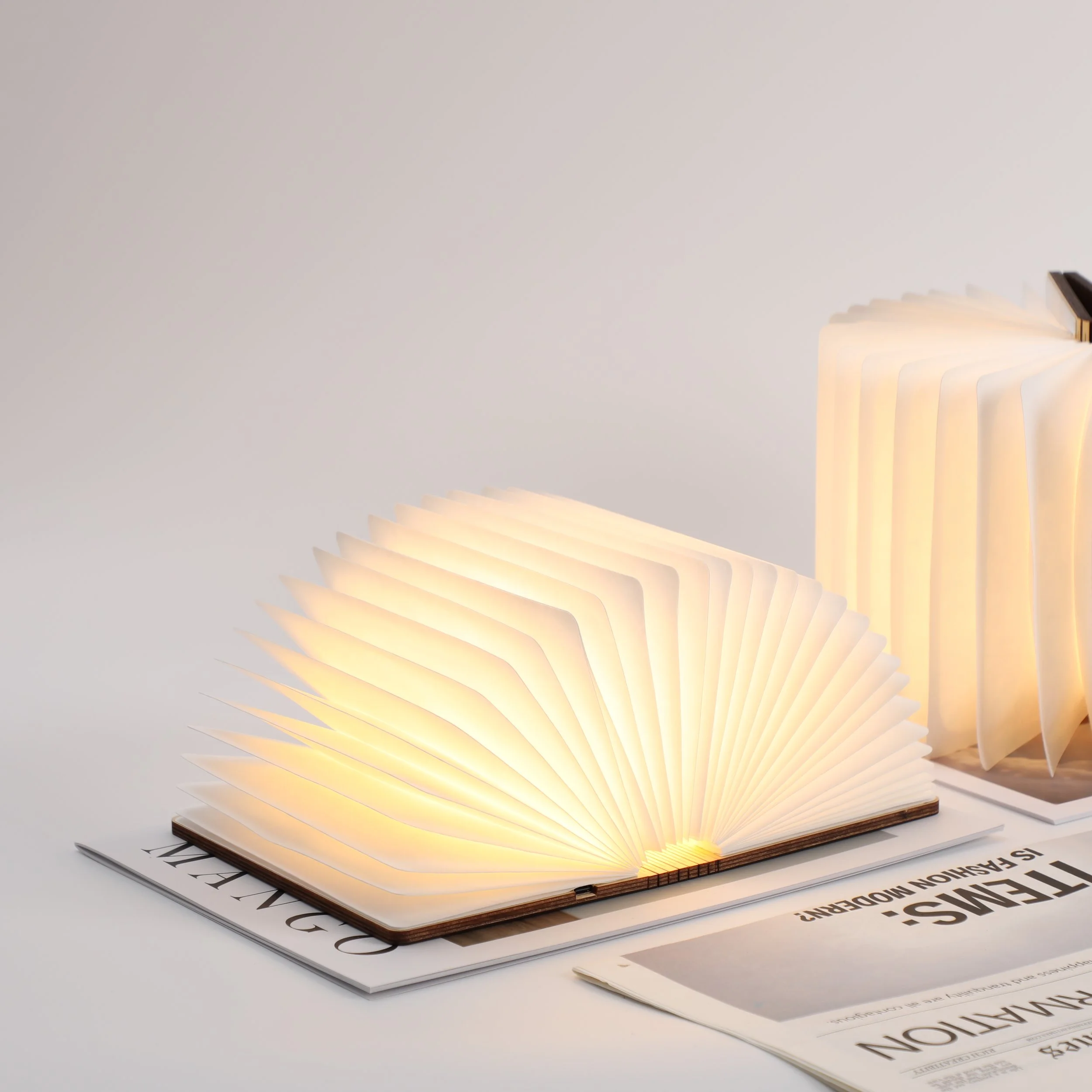 Lantern & Lore illuminated book lamp with folding pages and warm ambient light