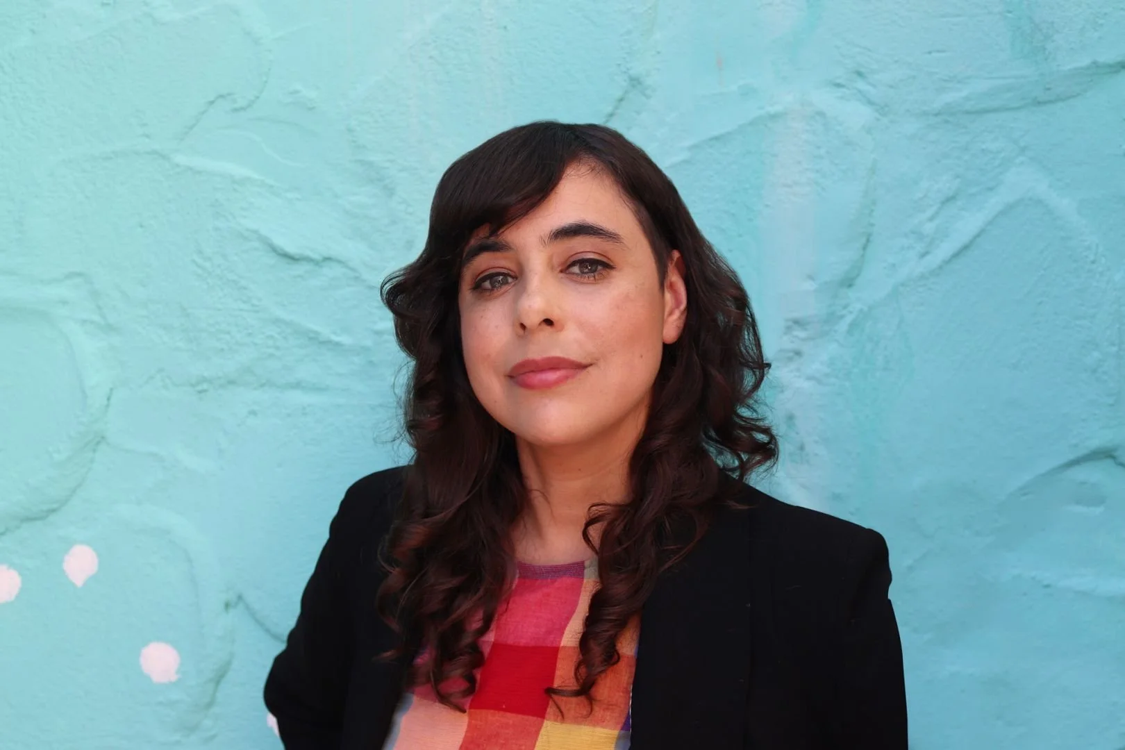 Photograph of Michelle Leclerc on blue background