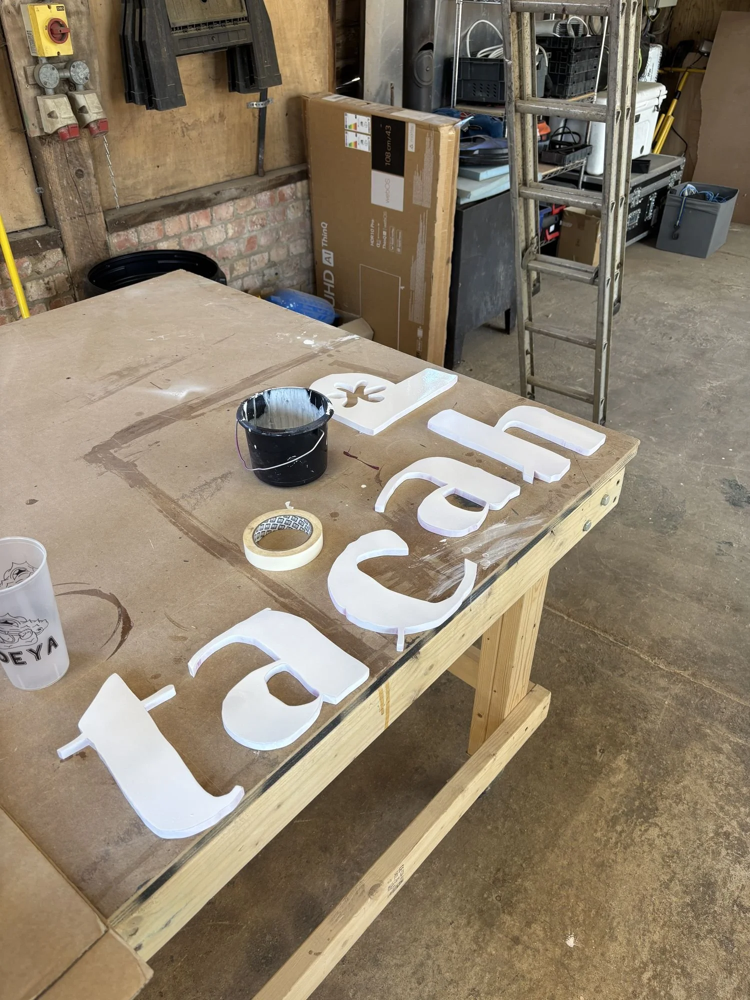 db-studios-patcha-london-hand-painted-lettering-in-the-workshop.jpg